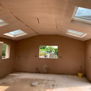 Plastering and rendering are construction techniques used to create smooth and even surfaces on walls and ceilings. Plastering involves applying a layer of plaster to a surface, while rendering involves applying a mixture of cement, sand, and water to a surface. Both techniques help to provide a finished look to a building's interior or exterior walls.